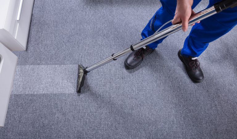 Man cleaning the carpet